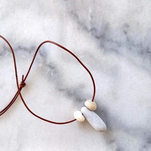 Three beach pebble pendant, beach stones necklace, pebble necklace in a adjustable light brown leather cord