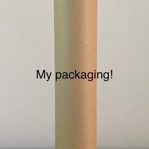 May include: A brown cardboard tube for shipping or storing rolled items. The tube has a white label with the text "My packaging!" printed on it.