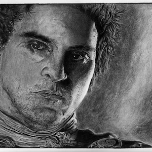 May include: A black and white pencil drawing of a man with a serious expression. He has short, curly hair and is wearing a dark shirt. The drawing is done in a realistic style and captures the man's emotions.