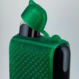 May include: A green 3D printed case with a textured surface and a matching green lid. The case is designed to hold a small electronic device.
