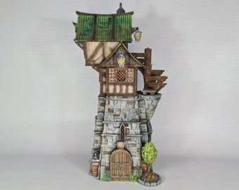 May include: A miniature stone tower with a wooden upper story and green roof. The tower has a small door and windows, and a wooden balcony with railings. There are two lanterns hanging from the balcony.