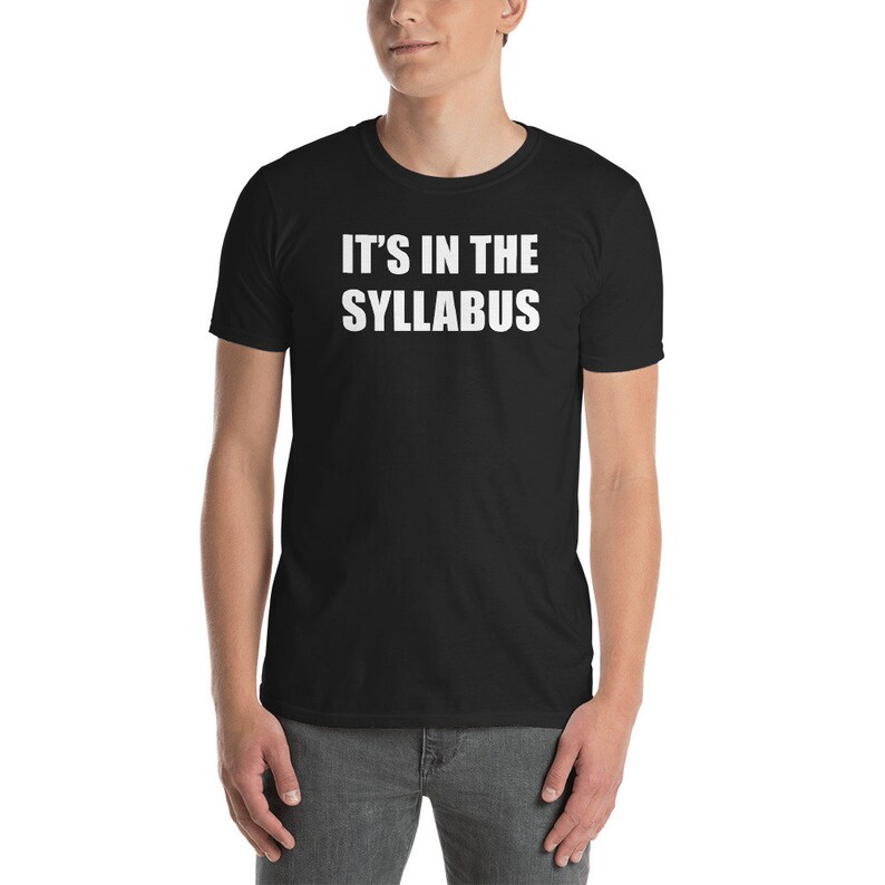 May include: Black t-shirt with white text that reads "IT'S IN THE SYLLABUS".