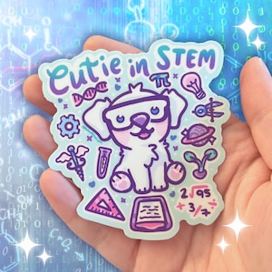 May include: A sticker with a cartoon dog wearing glasses and the text "Cutie in STEM." The sticker features science and math symbols, including a DNA strand, pi symbol, lightbulb, and mathematical equations. The color scheme is primarily blue, purple, and white.