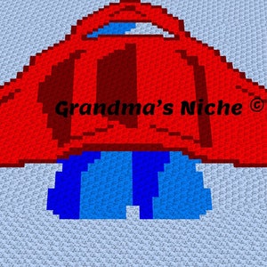 Könnte beinhalten: Ein rotes und blaues Häkel-Raketenschiff mit dem Text "Grandma's Niche ©" in Schwarz.