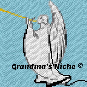 May include: A pixelated cross-stitch pattern featuring a white angel with gray shading playing a yellow trumpet against a light blue background. The text Grandma's Niche with a copyright symbol is printed in black at the bottom of the design.