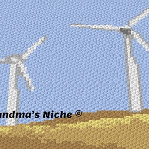 May include: A crochet pattern featuring two white windmills against a light blue sky. The windmills are standing on a brown field. The text "Grandma's Niche®" is at the bottom of the image.