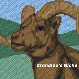 May include: A pixelated image of a ram's head and curved horns, in shades of brown and tan against a blue sky and green hills. The text "Grandma's Niche ©" is in the lower right corner.