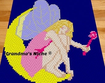 May include: A crochet pattern of a fairy with yellow hair, pink dress, and blue wings holding a pink wand. The pattern is on a blue background with the text "Grandma's Niche®".