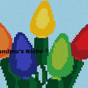 May include: A crochet pattern featuring five colorful light bulbs with green stems. The light bulbs are orange, yellow, blue, green, and red. The background is light blue.
