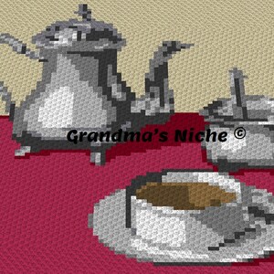 May include: A silver teapot, creamer, and cup and saucer on a red tablecloth. The teapot has a spout and handle. The creamer has a lid and a handle. The cup and saucer are white. The text "Grandma's Niche ©" is visible in the image.