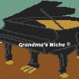 May include: A crochet pattern of a grand piano in black and gold. The piano is on a brown background. The text "Grandma's Niche ©" is in the centre of the image.