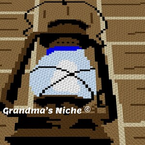 May include: A brown and black lantern with a blue and white glass pane. The lantern is hanging on a brick wall. The text "Grandma's Niche®" is visible at the bottom of the image.