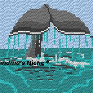 May include: A gray whale tail breaching the surface of the ocean, creating a spray of water. The water is a turquoise blue color. The text "Grandma's Niche" is in the lower left corner of the image.