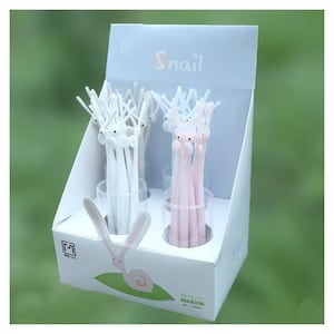 May include: A white display stand with the word "Snail" printed on it. The stand holds multiple white and pink pens with rabbit heads. The pens are arranged in clear plastic cups. The stand has a small snail illustration on the bottom.