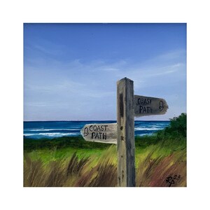 May include: A painting of a wooden signpost with two arrows pointing in different directions. The signpost is on a grassy hill overlooking a blue ocean with white waves. The signpost reads "Coast Path" on both arrows.