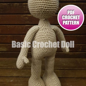 May include: A crocheted doll pattern, with a beige doll standing on a wooden surface. The doll has a round head, arms, and legs. The text "PDF CROCHET PATTERN" is in a pink circle on the image. The text "Basic Crochet Doll" is at the bottom of the image.