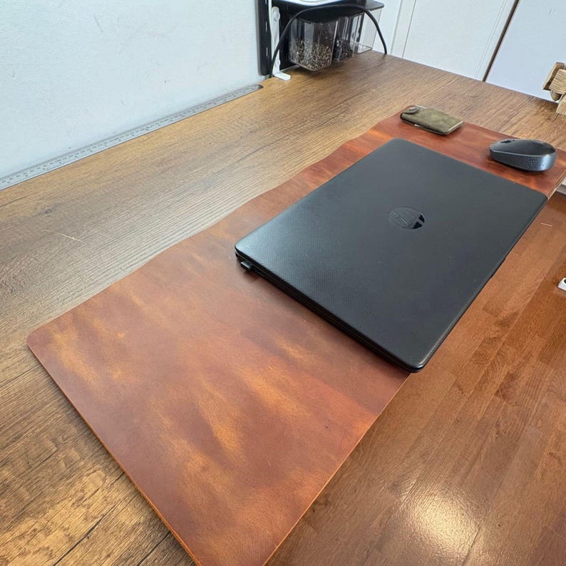 Rustic brown full grain leather desk mat, wide desktop view shows laptop, mouse, and rollable sturdy desk mat use