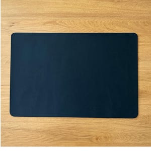 Deep blue full grain leather desk mat, large leather mouse pad scale shown on oak desk