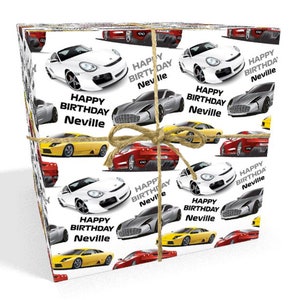 May include: A stack of white wrapping paper with a repeating pattern of colourful sports cars and the text "Happy Birthday Neville".