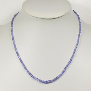 May include: A delicate necklace made of small, light purple beads. The necklace is approximately 18 inches long and is strung on a silver chain.