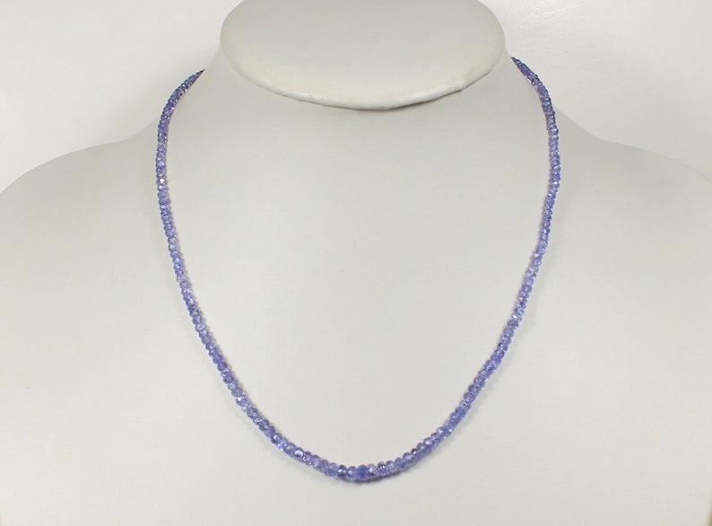 May include: A delicate necklace made of small, light purple beads. The necklace is approximately 18 inches long and is strung on a silver chain.