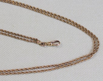 ANTIQUE 48-inch twisted link watch chain, with “dog clip,” rose gold filled,1910s, bright gold tone finish, A-1