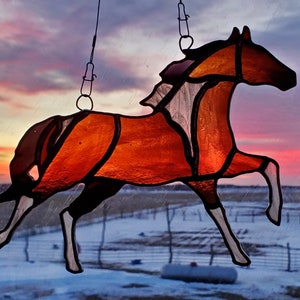 Stained glass running horse