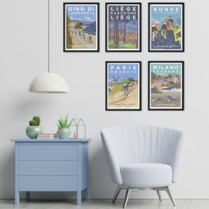 Minimalist room setting showing the set of 5 cycling prints hanging on the wall. They include Milan-San Remo in Italy, the Tour of Flanders in Belgium, Paris-Roubaix in France, Liège-Bastogne-Liège in Belgium, and Il Lombardia in Italy.