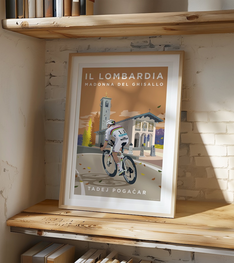 May include: A vintage-style poster featuring a cyclist riding a bicycle up a hill towards a church. The poster is titled "IL LOMBARDIA MADONNA DEL GHISALLO" and features the name "TADEJ POGAČAR" at the bottom.