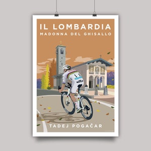 May include: A cyclist in a white and blue jersey rides a white bicycle up a hill towards a church with the words "IL LOMBARDIA MADONNA DEL GHISALLO" and "TADEJ POGAČAR" printed below. The scene is set against a sunset backdrop with fall leaves on the ground.