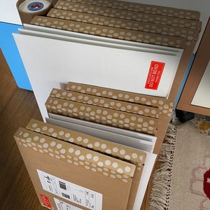 JensCyclingArt packaging example: showing boxes, envelopes and tubes well protected and ready for dispatching cycling prints to a global customer base.