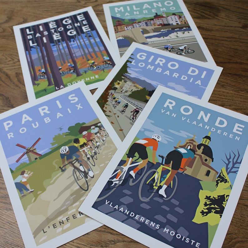 Showing the 5 Monument Set cycling prints laid on a table. Excellent quality giclee prints.