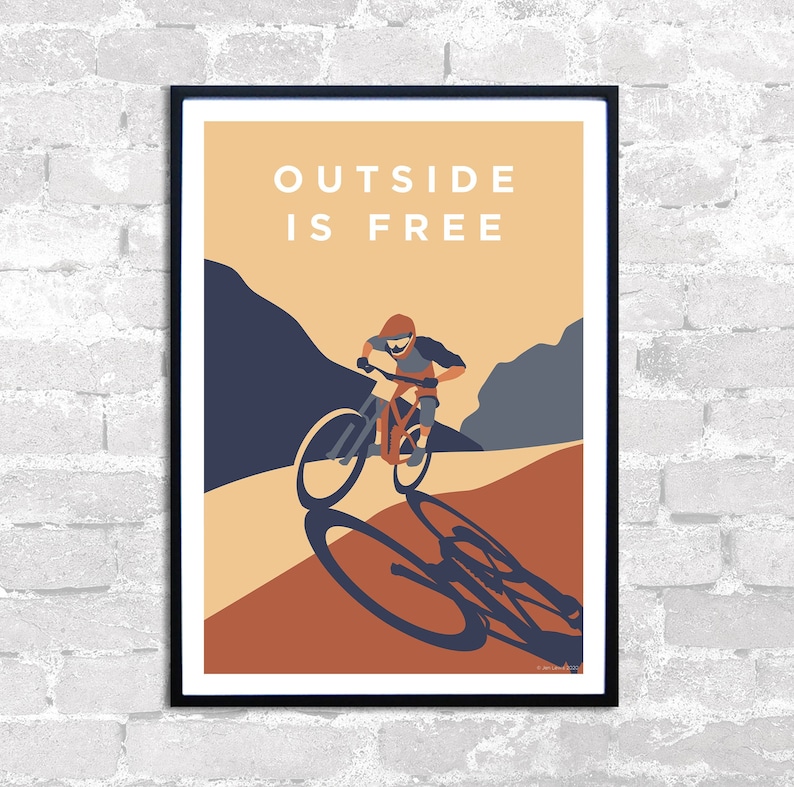 May include: A poster with a mountain biking illustration and the text "OUTSIDE IS FREE". The poster has a brown, orange, and blue color scheme.