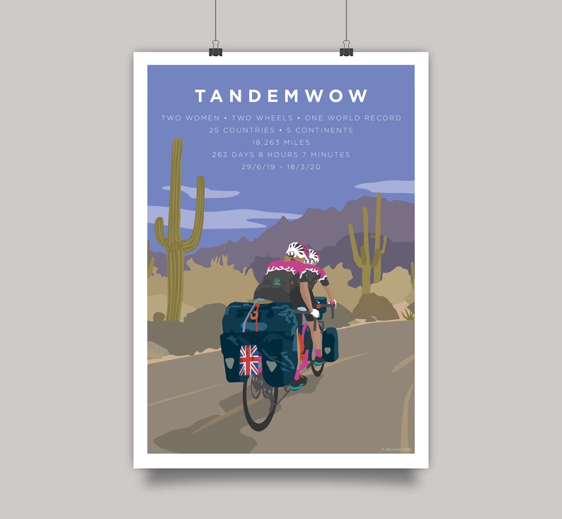 TandemWoW Guinness World Record Holders Cycling Print showing the women tandem cyclists riding through a desert with cacti and mountains on their world record breaking challenge.