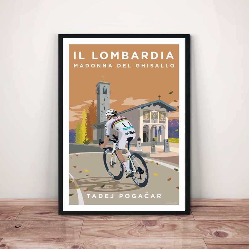 May include: A poster with a cyclist riding a bicycle up a hill towards a church. The poster is titled "IL LOMBARDIA MADONNA DEL GHISALLO" and features the name "TADEJ POGAČAR" at the bottom.