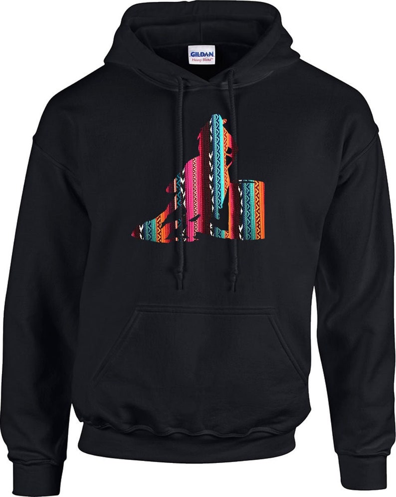 May include: Black hooded sweatshirt featuring a colourful graphic of a person riding a horse. The graphic is in a southwestern style with geometric patterns.