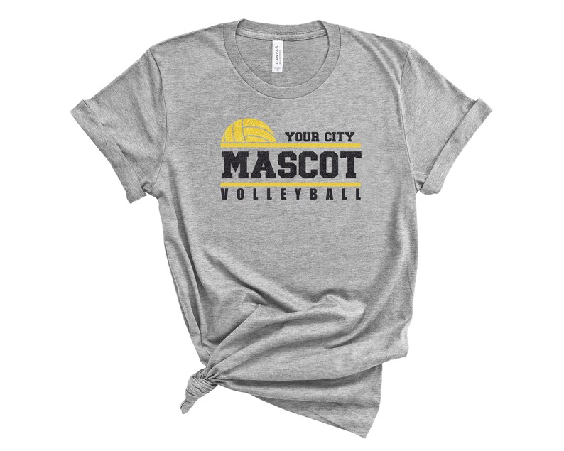 May include: Gray t-shirt with a yellow volleyball graphic and the text "YOUR CITY MASCOT VOLLEYBALL".