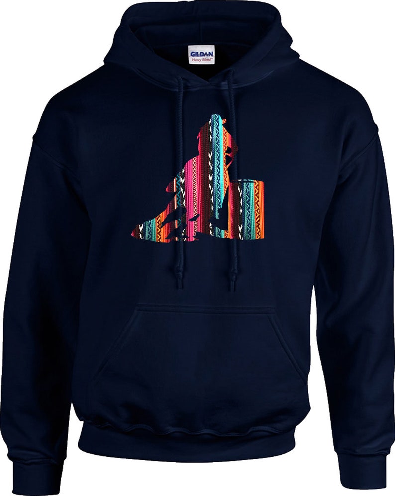 May include: A navy blue hooded sweatshirt featuring a colourful graphic of a person riding a barrel horse. The graphic is in a southwestern style with bright colours and geometric patterns.
