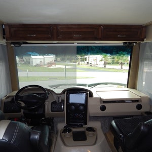 View from inside a Class A motorhome with RV windshield privacy shade installed.