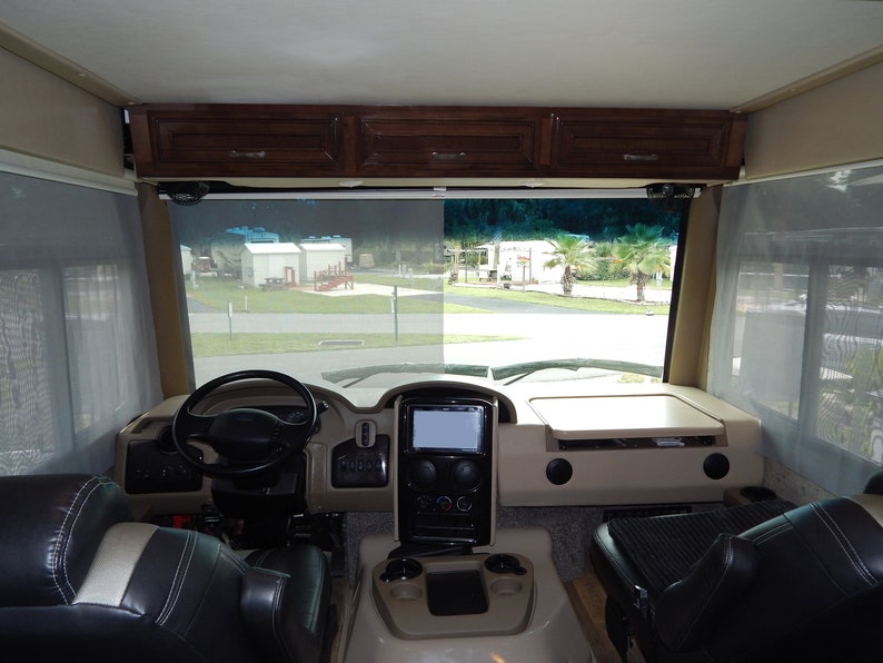 View from inside a Class A motorhome with RV windshield privacy shade installed.