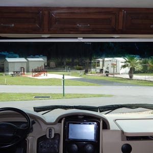 Interior RV windshield privacy shade installed on a Class A motorhome windshield.