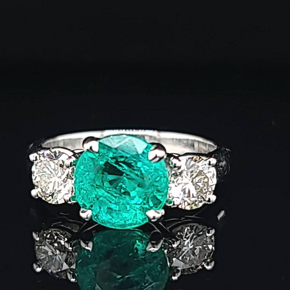 Customised Platinum Ring with Emerald