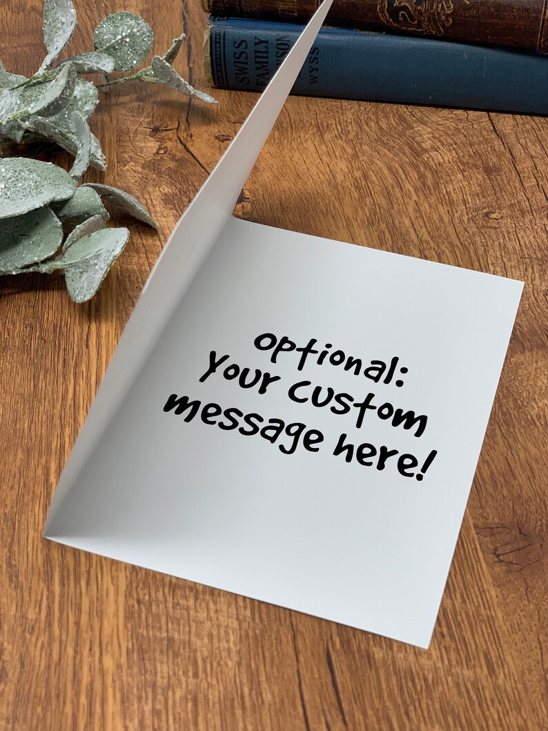 May include: Blank white card with the text "optional: your custom message here!" written in black marker.
