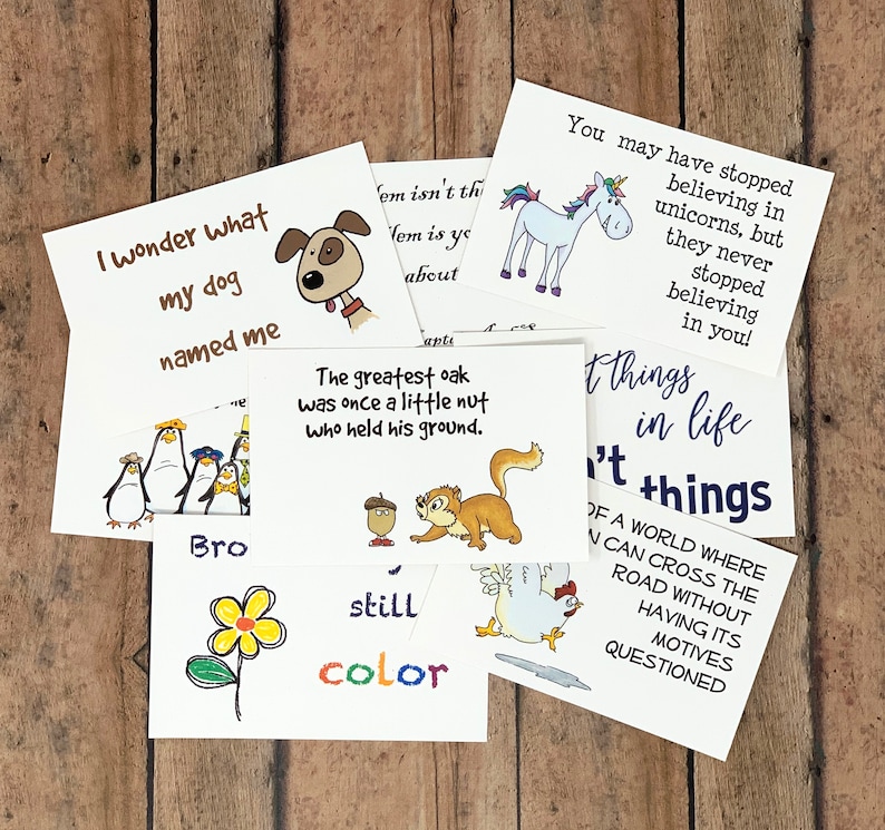 May include: A set of 10 colorful cards with inspirational quotes and illustrations. The cards feature a dog, a squirrel, a penguin, a unicorn, a chicken, a flower, and a nut. The text on the cards includes quotes like "I wonder what my dog named me" and "The greatest oak was once a little nut who held his ground."
