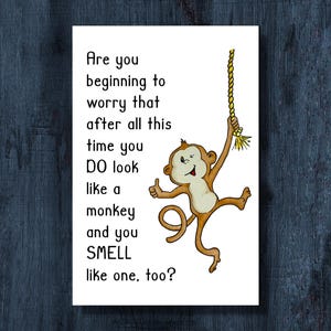 May include: A white ceramic mug with a black handle and the text "But first, coffee" in a black, handwritten-style font. The mug is on a white surface.