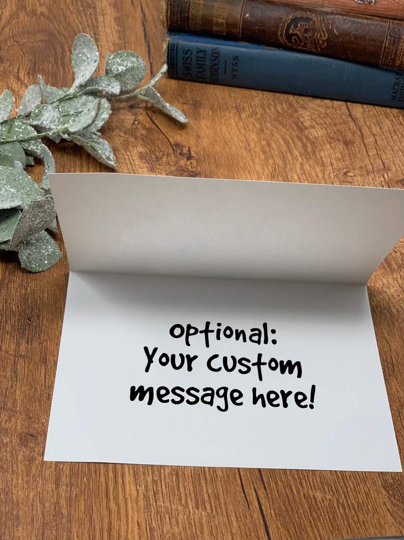 May include: Blank white card with the text "optional: your custom message here!" written in black marker.