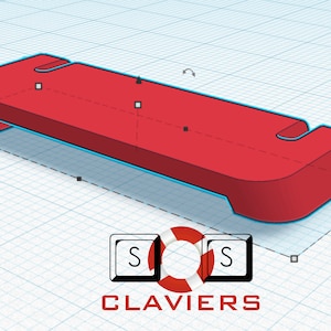 Könnte beinhalten: Ein 3D-Modell eines roten Kunststoffteils mit abgerundetem Ende und zwei Aussparungen. Das Modell wird auf einem Rasterhintergrund gezeigt.