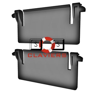 May include: Two black sun visors with a black plastic frame and a grey fabric shade. The visors are designed to fit inside a car.