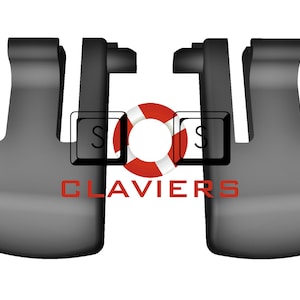 May include: Two dark gray, stylized, curved objects with a rectangular logo in the center. The logo features the letters "S" and a red and white life preserver. The word "CLAVIERS" is written in red below the logo.