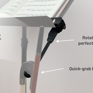 May include: A black music stand attachment with a quick-grab hook and adjustable angle. The attachment is designed to hold sheet music and provides plenty of clearance. The text on the image says "Rotate to perfect angle" and "Quick-grab hook."